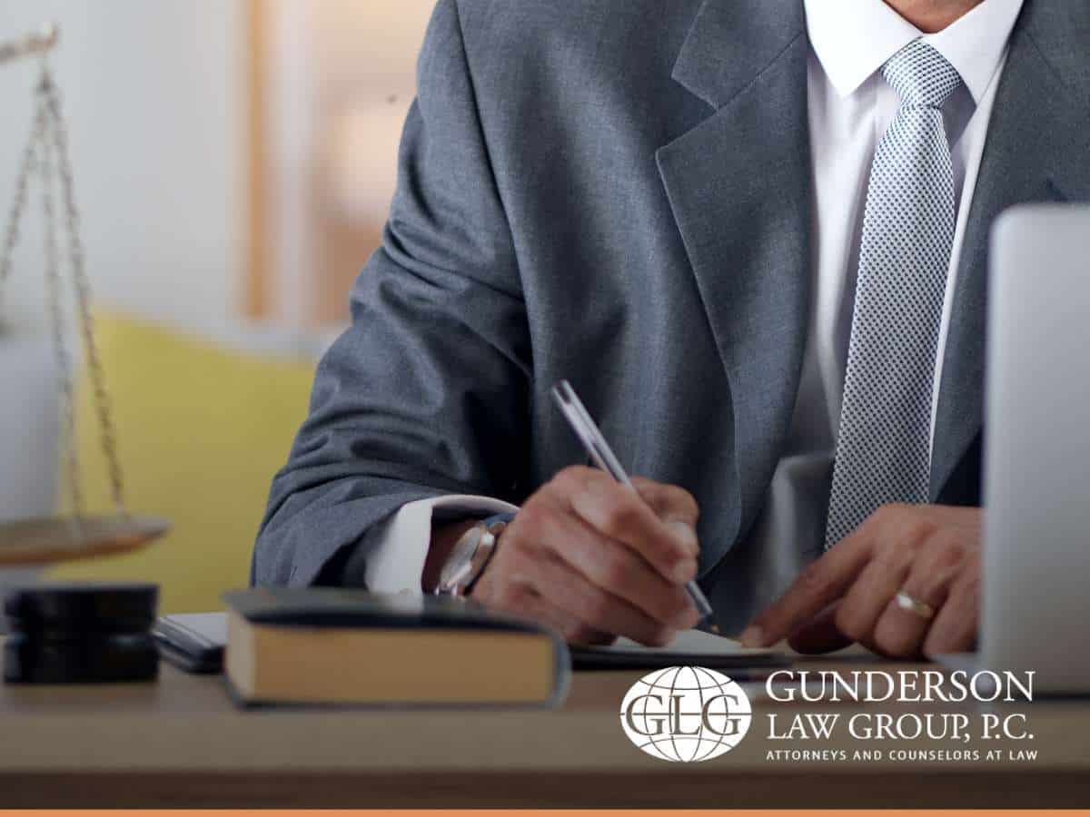 Attorney drafting an estate plan, ensuring asset protection and legal security – Gunderson Law Group, P.C